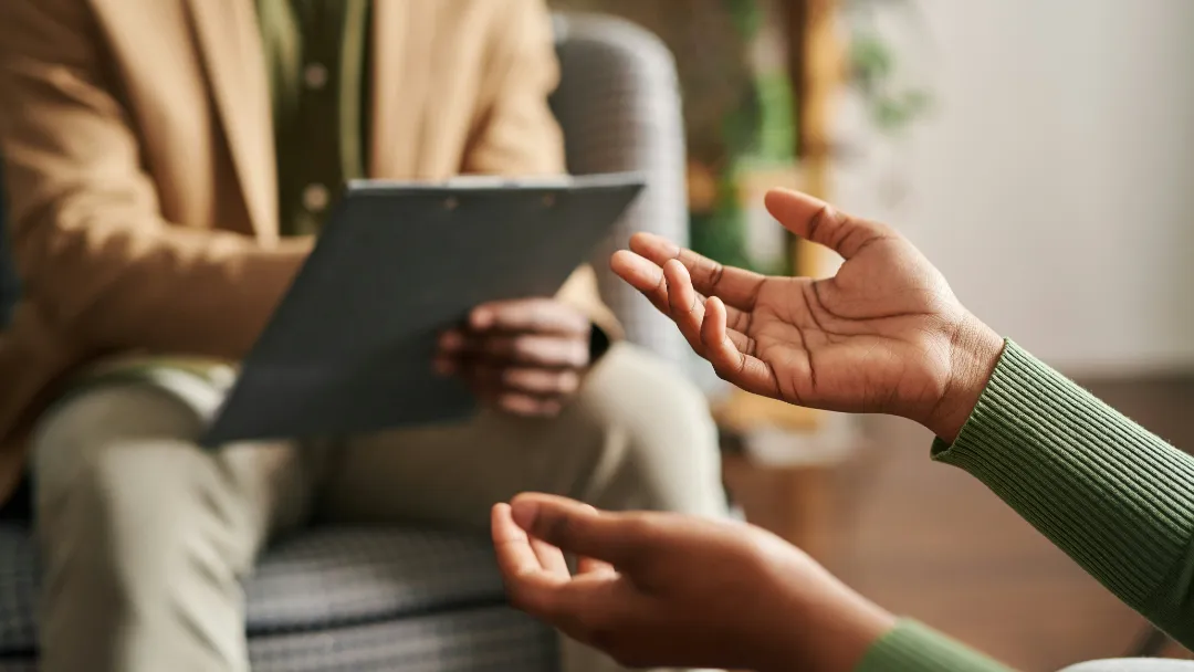 Woman talking to another young woman