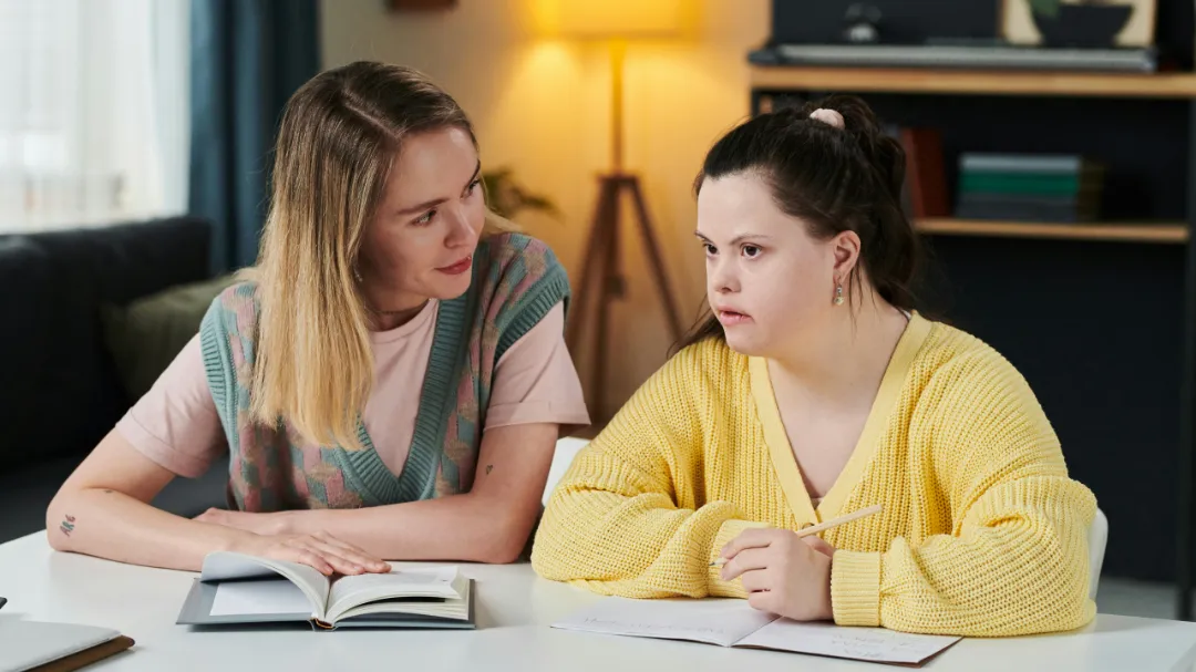 Woman talking to another young woman